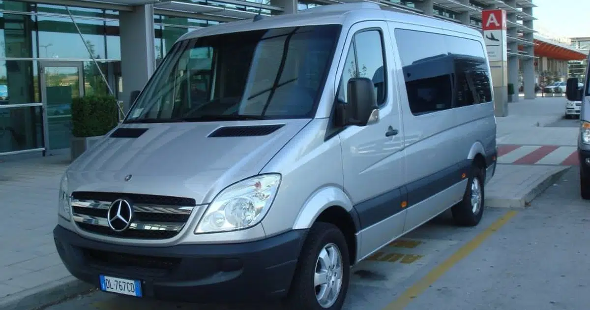 A 10 seater minibus Mercedes Sprinter parked at the airport in Ancona