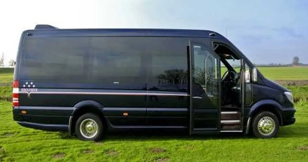 A 16 seater minibus Mercedes Sprinter parked on a field in Eindhoven