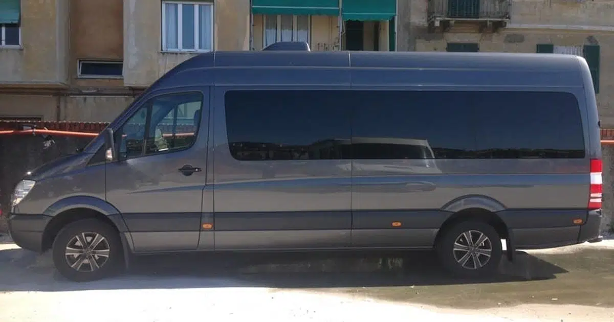 A 16 seater Mercedes Sprinter minibus parked in Genoa