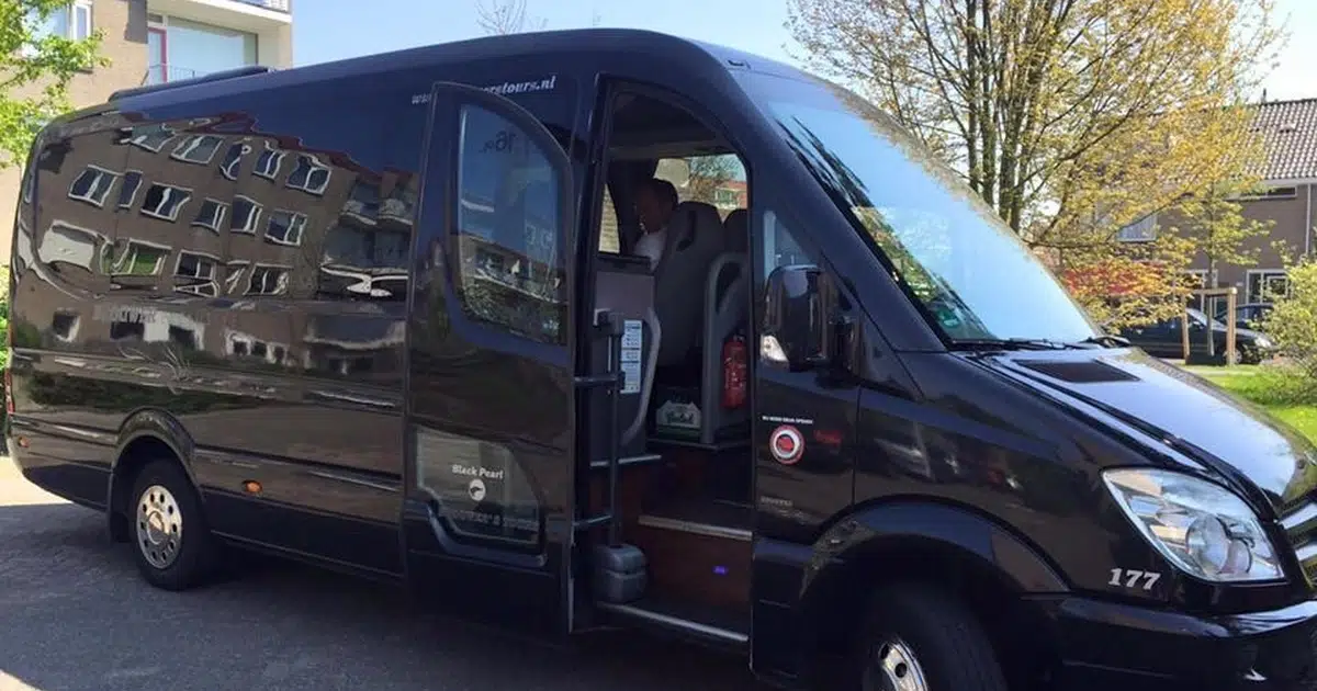 A 16 seater minibus Mercedes Sprinter parked at a street in Leiden