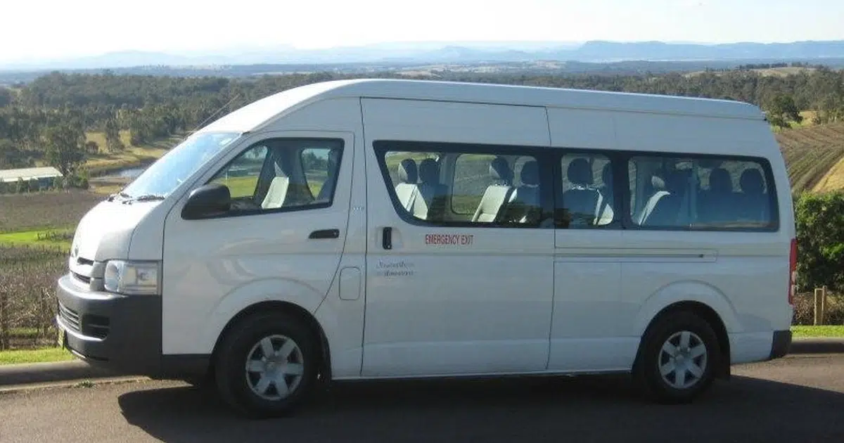 A 13 seater minibus Mitsubishi Sprinter parked near a winery in Newcastle