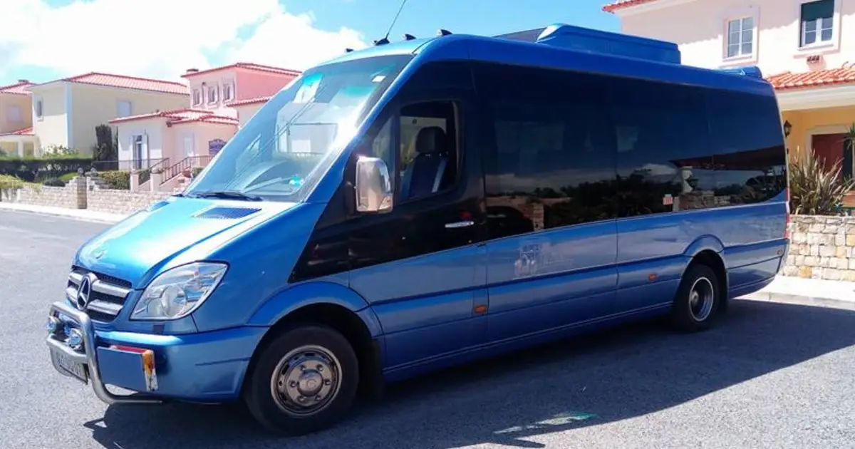 A 16 seater Mercedes Sprinter minibus parked at a street in Lisbon