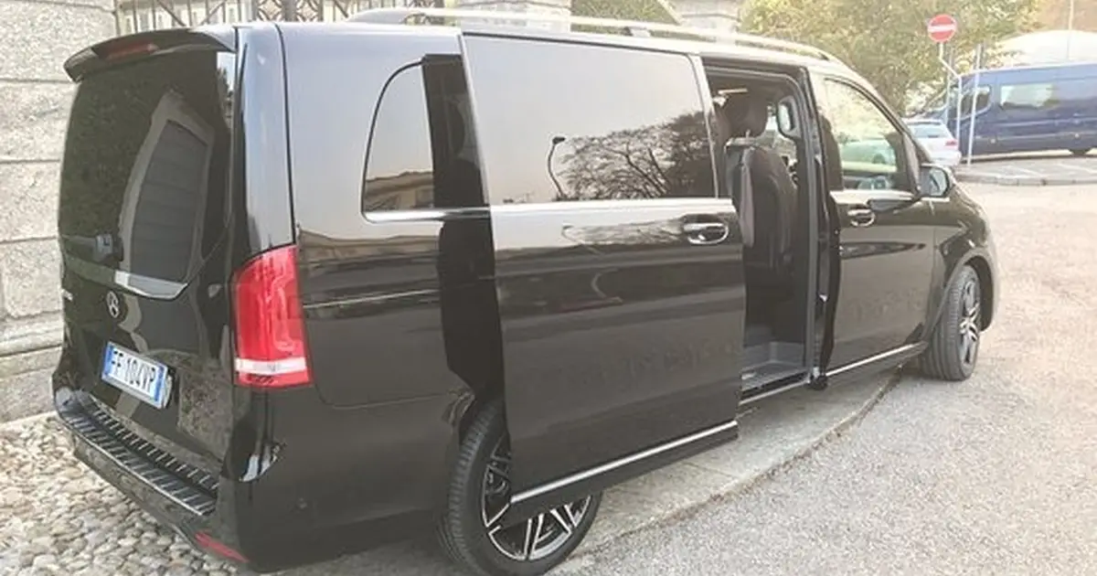 A 20 seater minibus Mercedes Sprinter parked in Milan