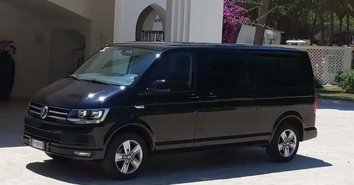 A 12 seater minibus Volkswagen Sprinter parked in front of a hotel in Cagliari