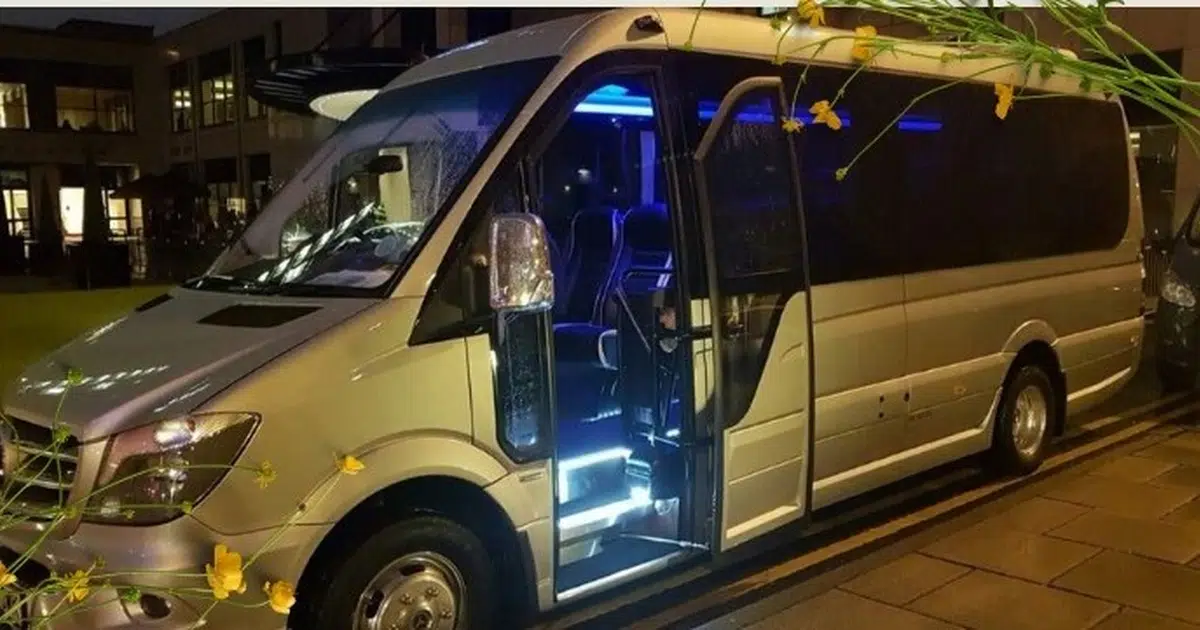 A 16 seater Mercedes Sprinter minibus parked at a street in Birmingham