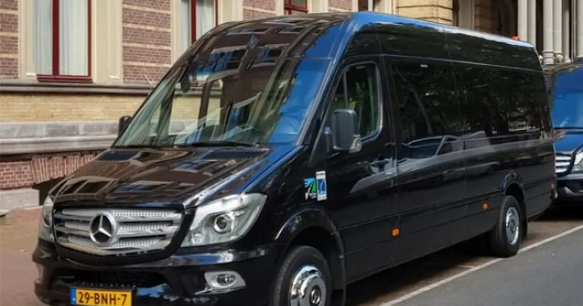 A 20 seater Mercedes Sprinter minibus parked in Bruges
