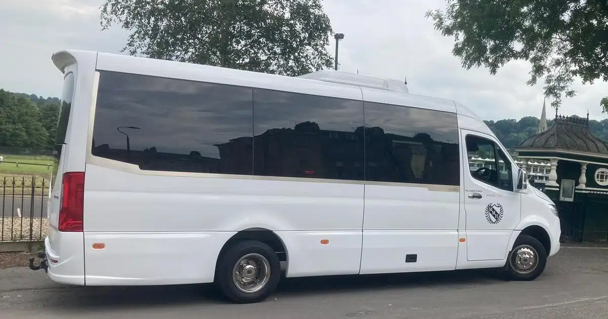 A 16 seater minibus Mercedes Sprinter parked in Bath