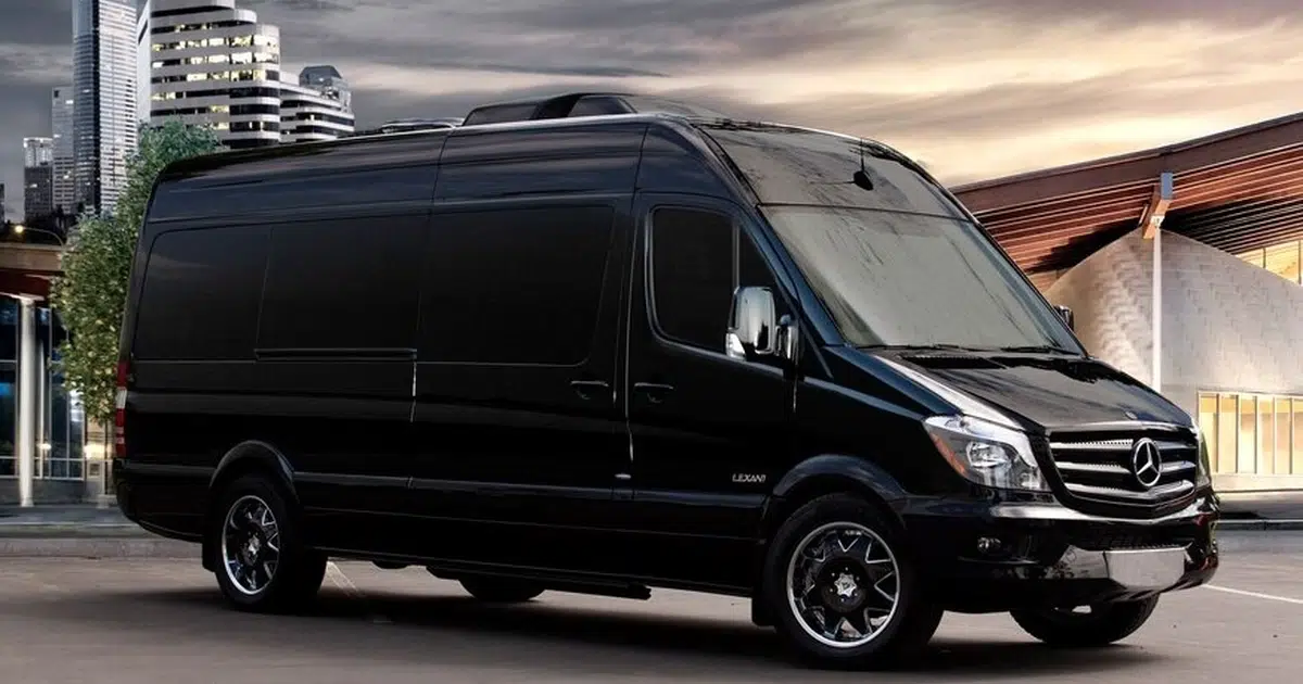 A 16 seater minibus Mercedes Sprinter at a street in Lincoln