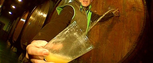 Basque cider pouring from barrel