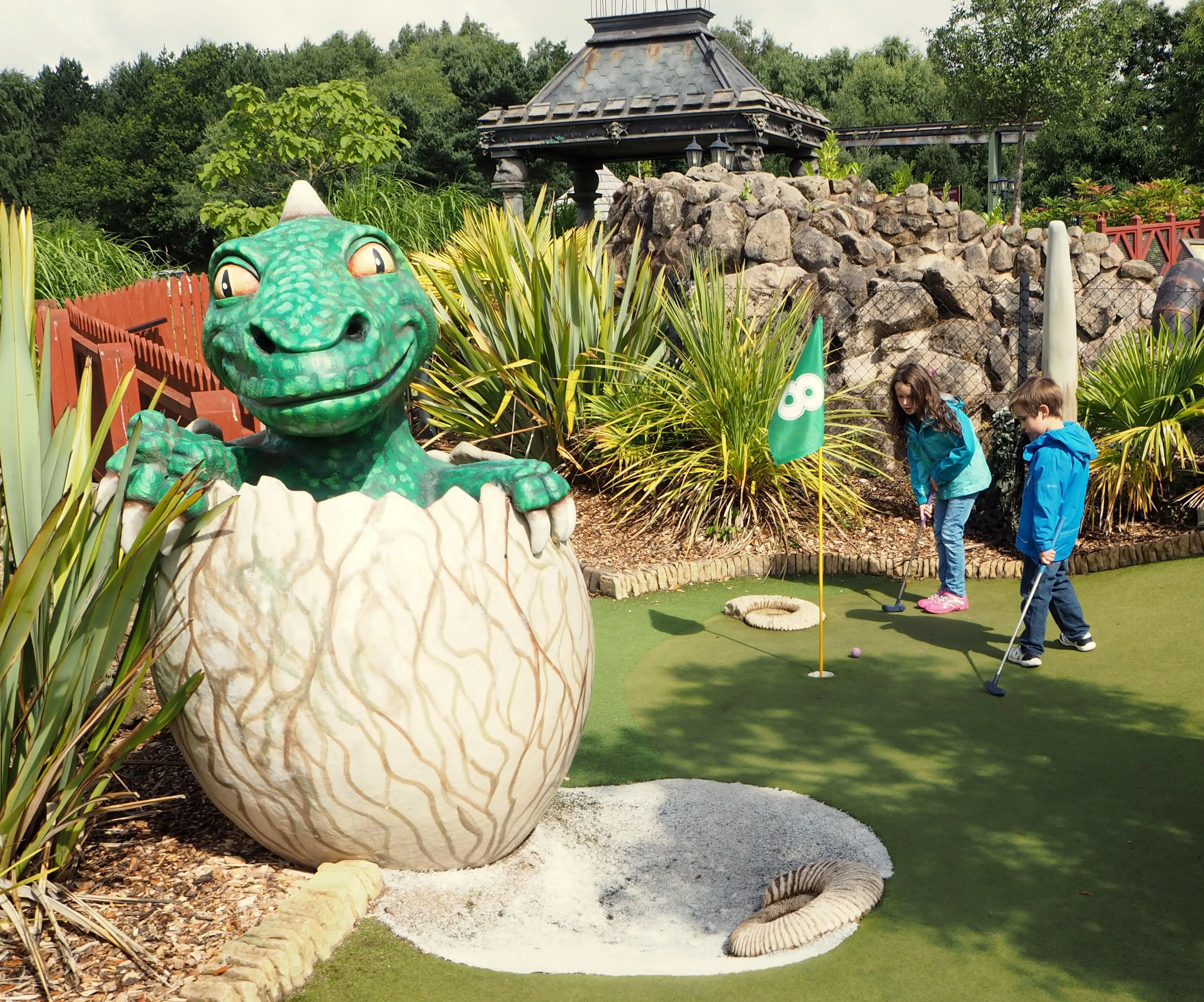 Dinosaur Hatching By Golf Course